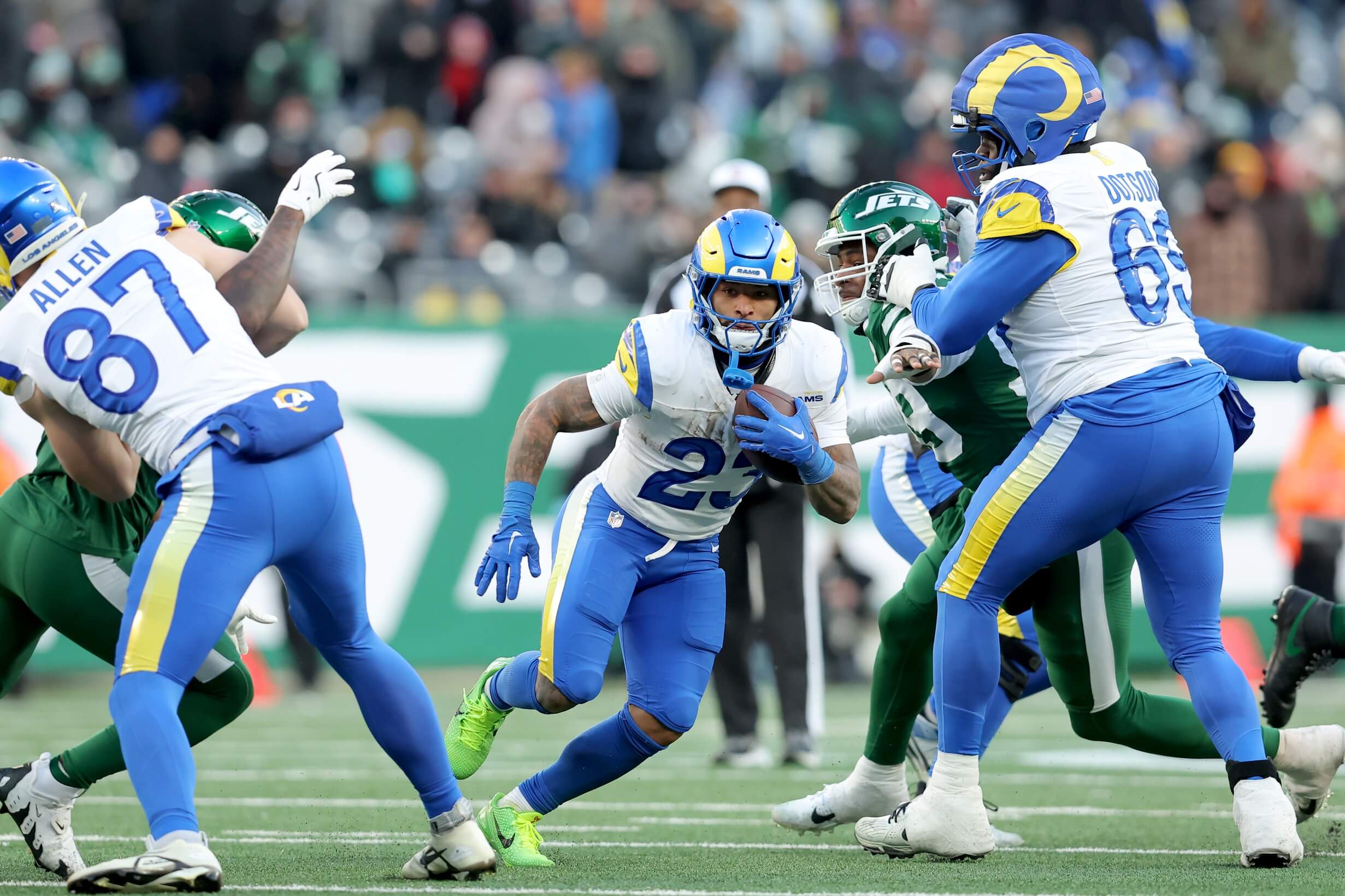 Dec 22, 2024; East Rutherford, New Jersey, USA; Los Angeles Rams running back Kyren Williams (23) runs with the ball against the New York Jets during the fourth quarter at MetLife Stadium. Mandatory Credit: Brad Penner-Imagn Images