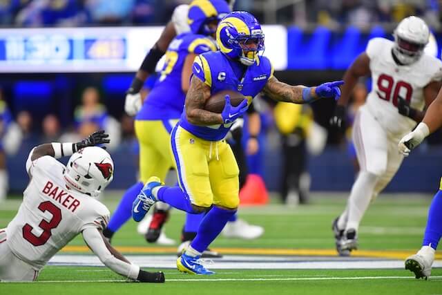 Jan 4, 2026; Inglewood, California, USA; Los Angeles Rams running back Kyren Williams (23) carries the ball as Arizona Cardinals safety Budda Baker (3) defends during the second half at SoFi Stadium. Mandatory Credit: Gary A. Vasquez-Imagn Images Kyren Williams