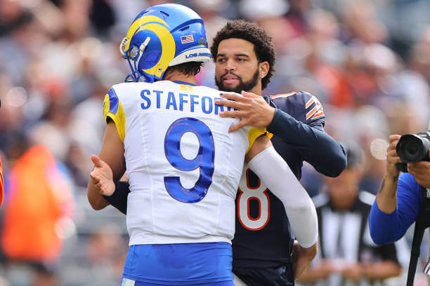 CHICAGO, ILLINOIS - SEPTEMBER 29: Matthew Stafford #9 of the Los Angeles Rams greets Caleb Williams #18 of the Chicago Bears during the pregame coin toss prior to the game at Soldier Field on September 29, 2024 in Chicago, Illinois. (Photo by Michael Reaves/Getty Images) Matthew Stafford, Caleb Williams, Rams, Bears
